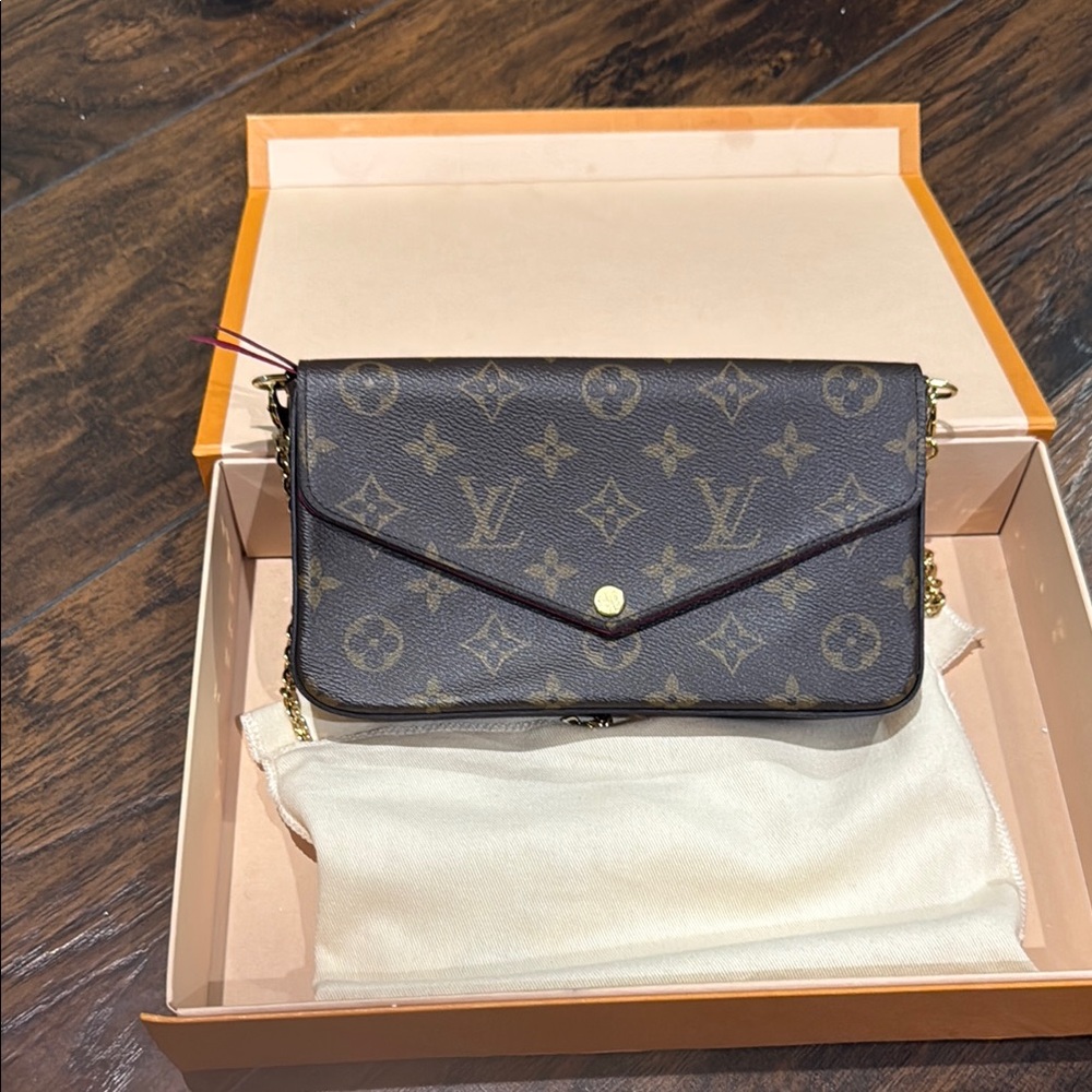 Louis Vuitton Brown Monogram Clutch with Gold Accents
